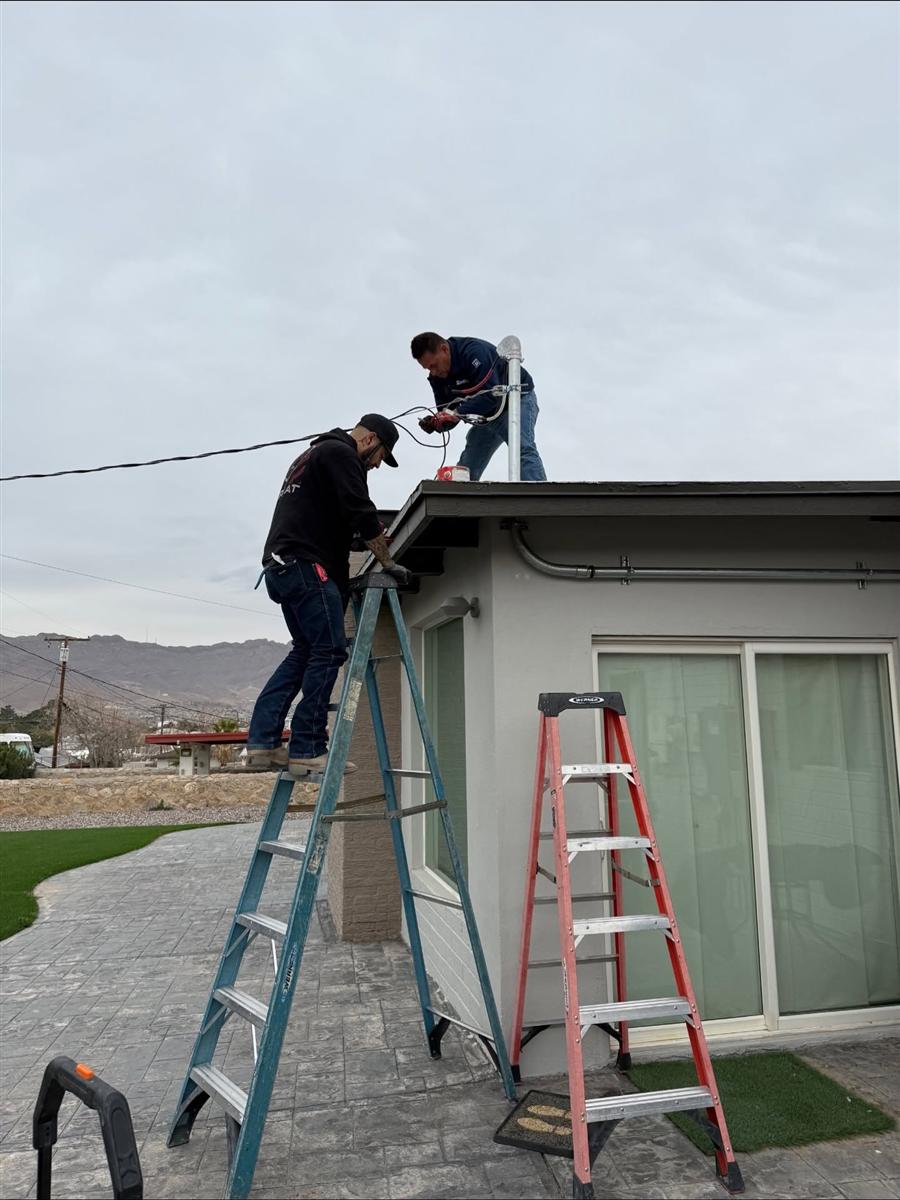 Tovar Electric technicians working on wiring at a home in El Paso